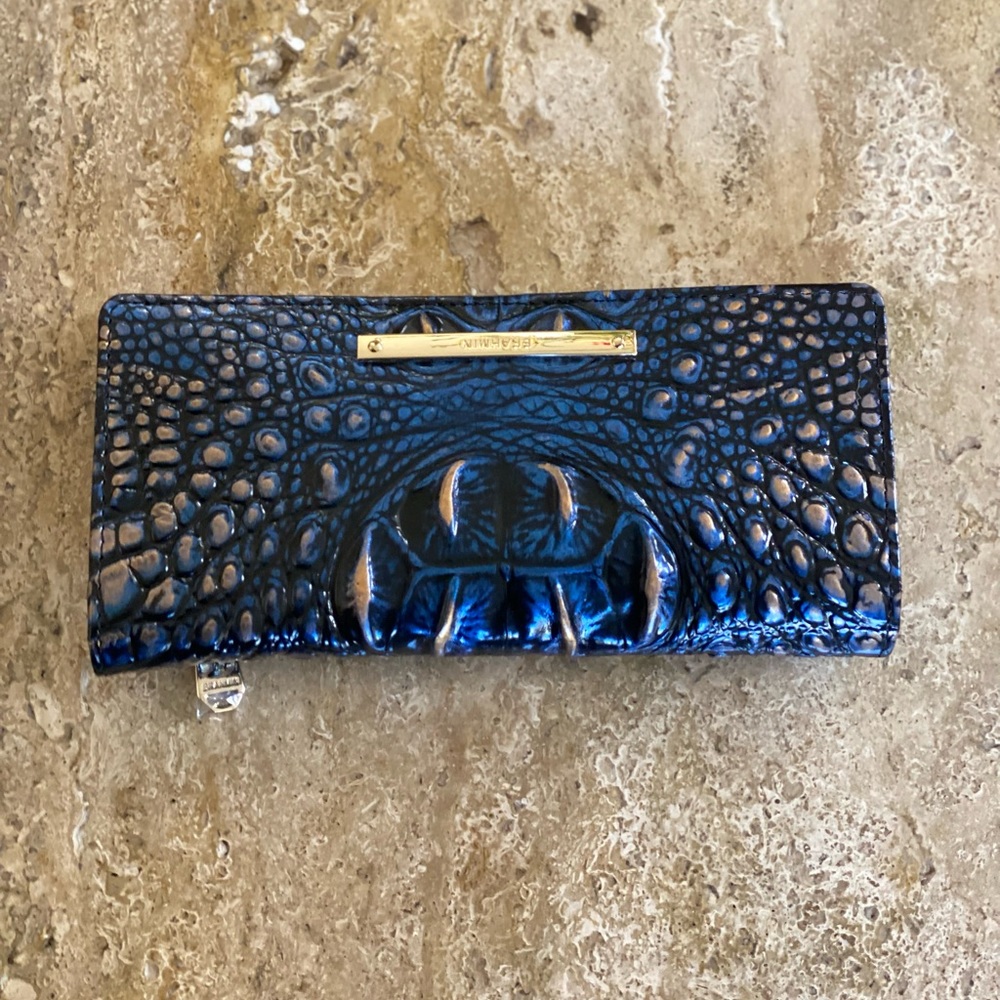 Brahmin vibrant blue black and gold wallet.